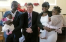 DR Felix & his Wife Evelyn brought their children to be Dedicated